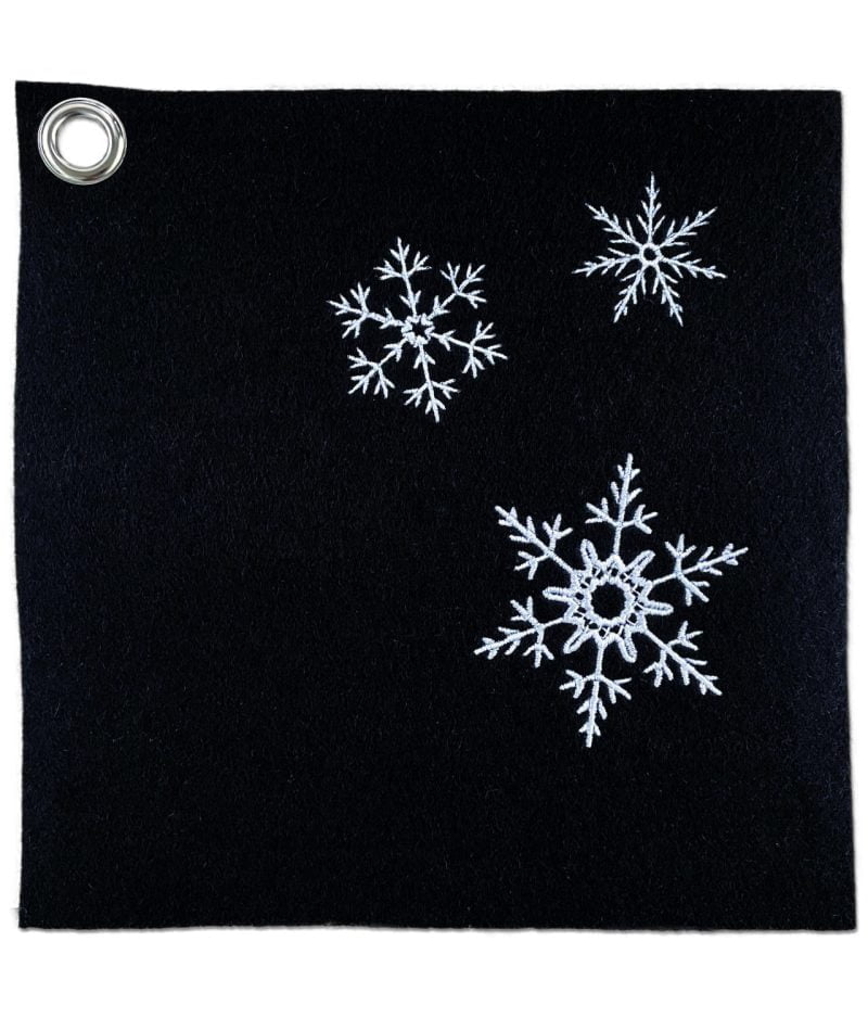 Black handcrafted potholder of wool felt, with three snowflakes machine embroiederd with white viscose thread.