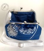 Blue opened Melody Purse from the front view. Lining made of blue canvas-like upholstery fabric remnants.